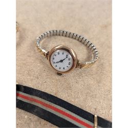 Two ladies 9ct gold cased manual wind wrist watches, both on expanding base metal straps, together with a gentlemans 9ct gold cased wristwatch on canvas strap