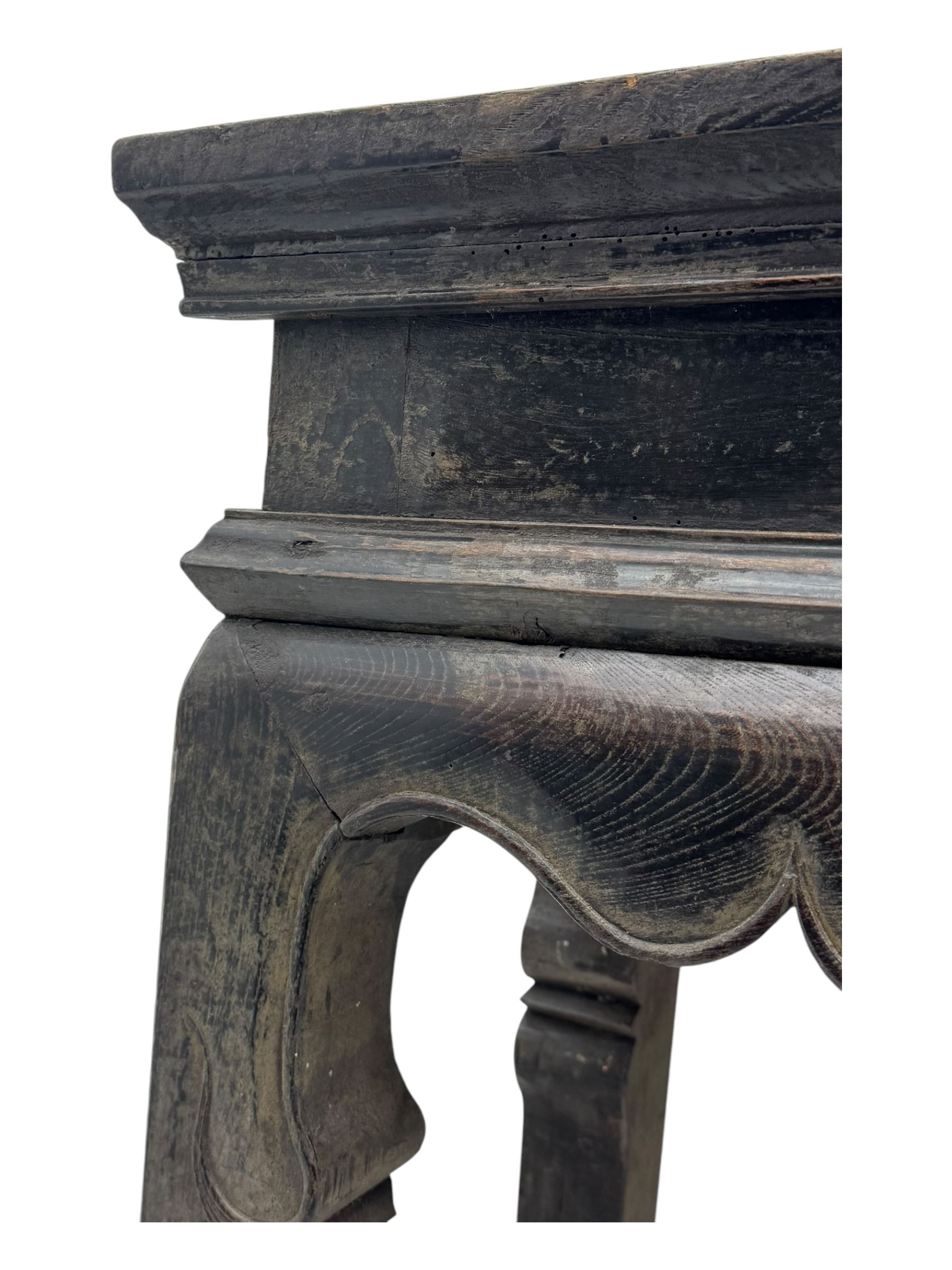 19th century Chinese black lacquer console table, rectangular moulded top over full-width drawer and scalloped apron with carved corner details, raised on square-section legs
