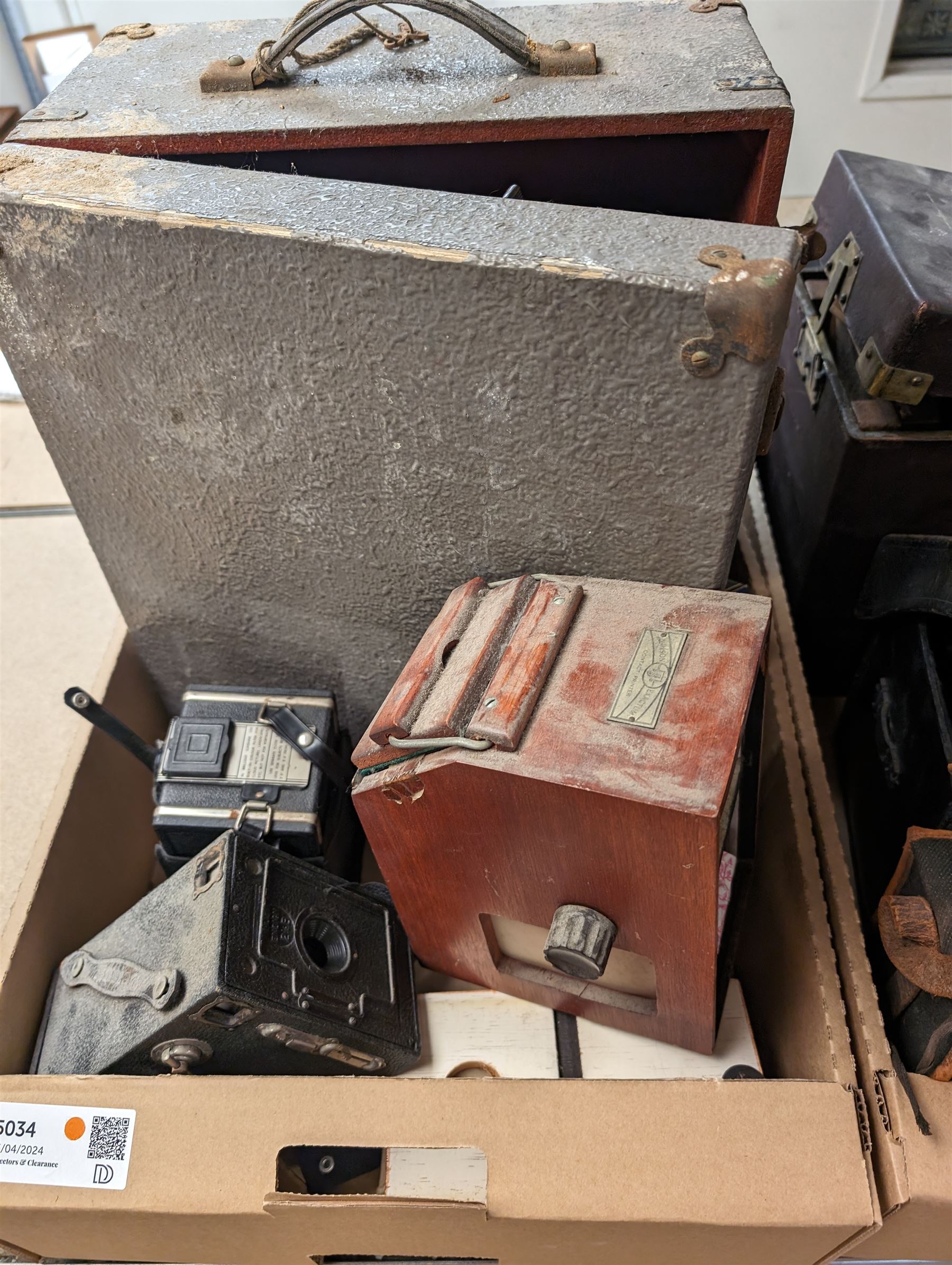 Bell & Howell Gaumont cine projector model 602, together with a Coronet Twelve 20 camera, Junior Special plate camera, folding plate cameras and accessories, in two boxes 