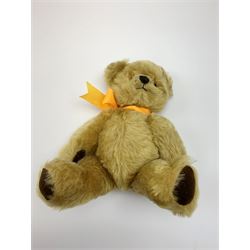 Chad Valley Hygienic Toys teddy bear c1950, kapok filled mohair plush body with original factory given yellow neck ribbon, jointed limbs with velvet paw pads, glass eyes and vertically stitched nose and mouth, blue/white printed label to side seam H12