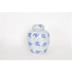 Blue and white ginger jar, decorated in a repetitive pattern of fish swimming amongst dense clusters of aquatic foliage, H40cm
