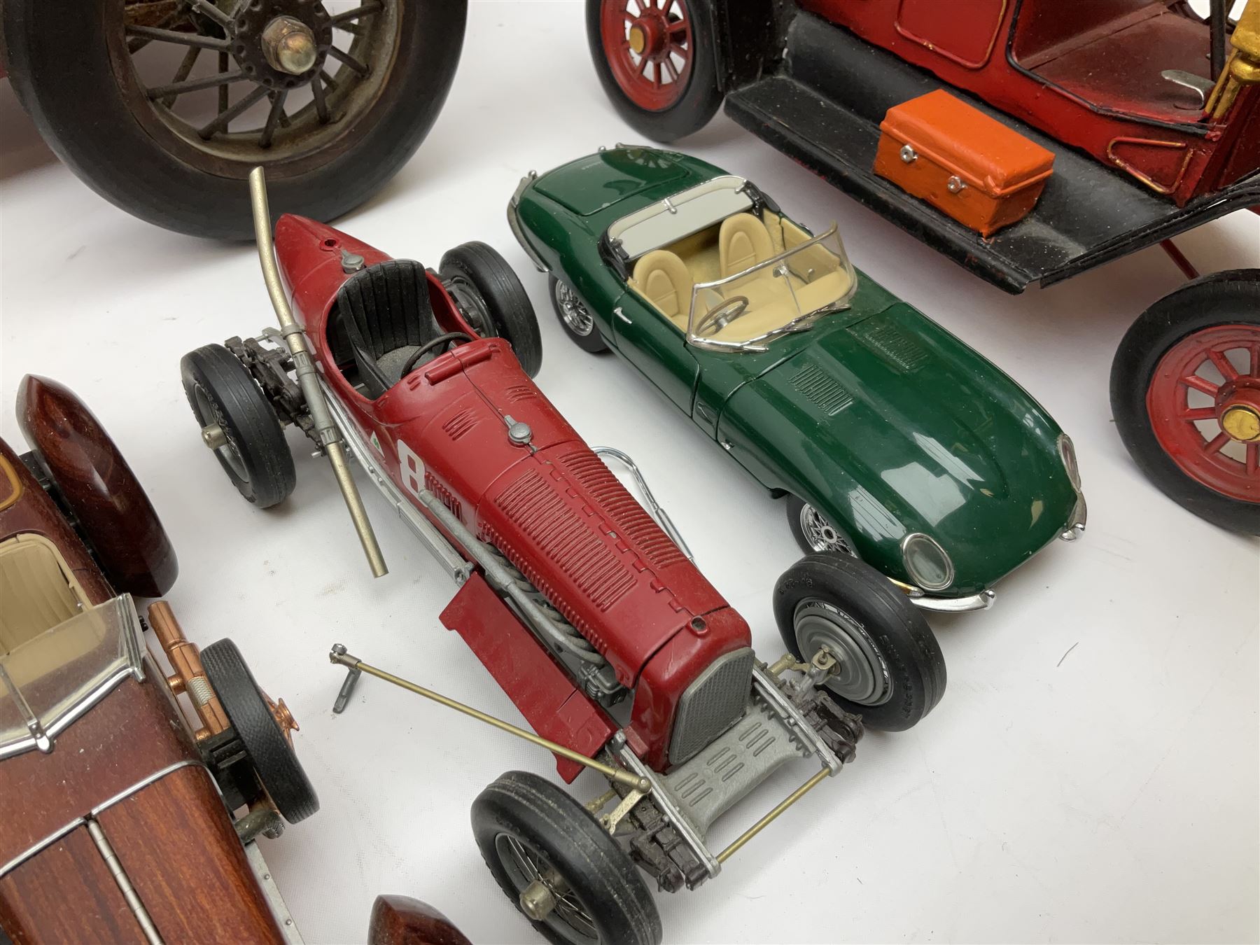Four Franklin Mint Precision Models, one with hardwood body; large reproduction model of a vintage racing car L52cm; and four other modern metal/wooden models of vintage cars; all unboxed (9)