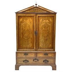 Georgian mahogany Dutch style marquetry press cupboard on chest, sloped finial pediment inlaid with trailing foliate, two panelled doors enclosing linen slides inlaid with floral urns, the chest fitted with two short and single long drawer and inlaid with shell and bird motifs, on bracket feet