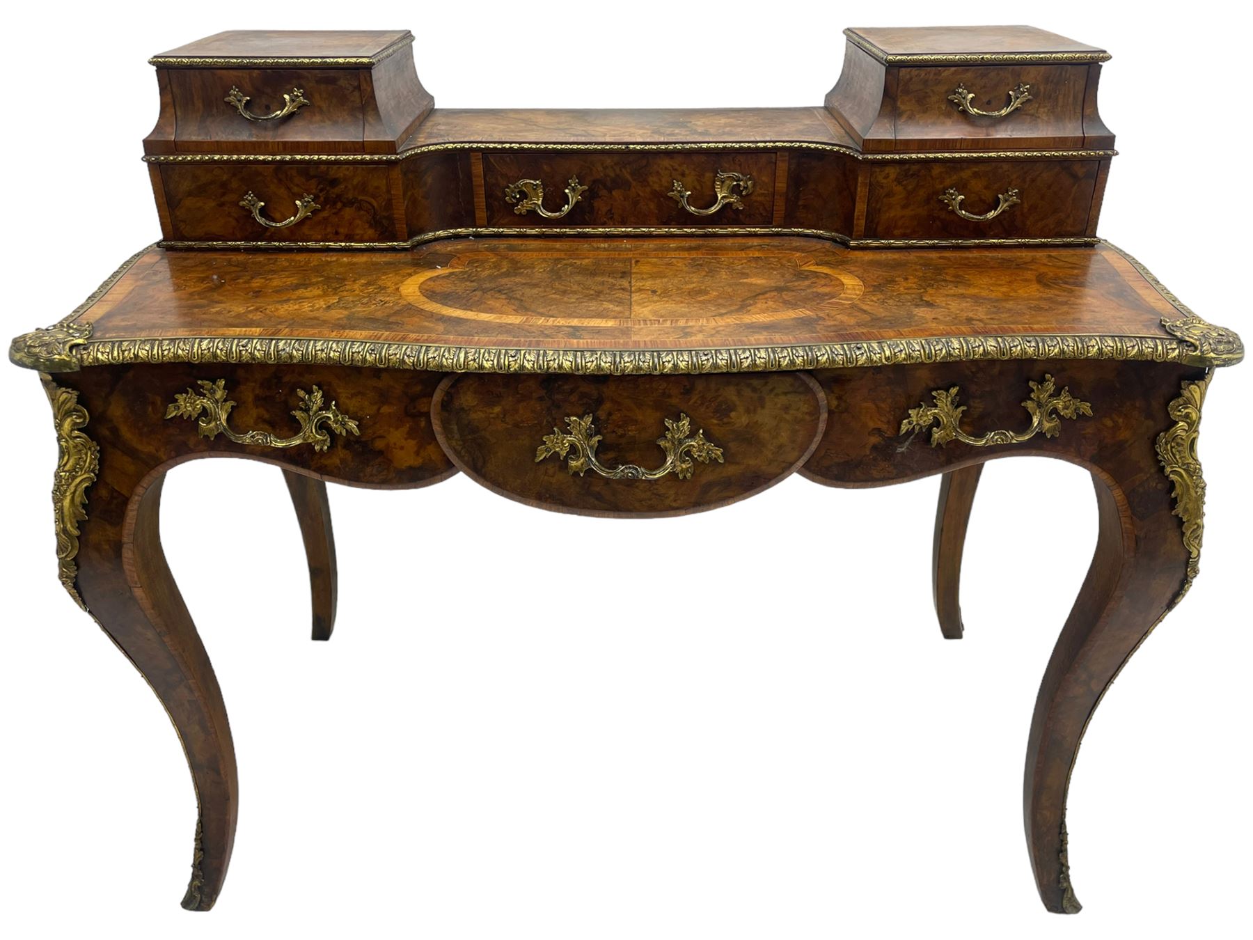 Late 19th to early 20th century French figured walnut writing desk, raised back fitted with drawers, shaped top with Kingwood banding and foliage cast edge moulding, fitted with single drawer, on cabriole supports mounted by shell and flower head cartouches 