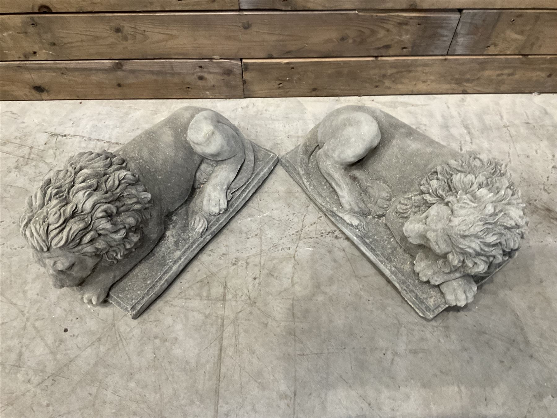 Pair of small recumbent garden lions