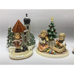 Eight Christmas Hummel figures by Goebel, to include Wintertime Chapel candle holder, Winter Fun, Christmas Morning, Christmas Time and Gingerbread Lane, tallest H21cm
