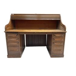 Cutler - early 20th century American oak tambour roll-top desk, the twin pedestals fitted with four graduating drawers