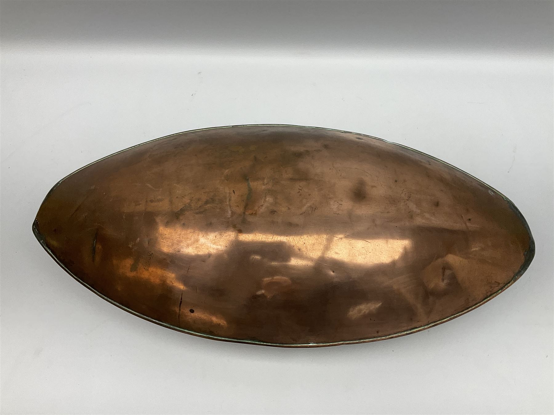Victorian copper carriage foot warmer of flattened oval form with two carrying handles, L70cm