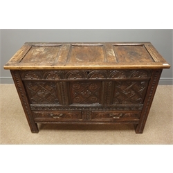  18th century heavily carved oak mule chest, panelled lid, lunette and chip carved front, two drawers, on stile supports, W123cm, H82cm, D49cm  