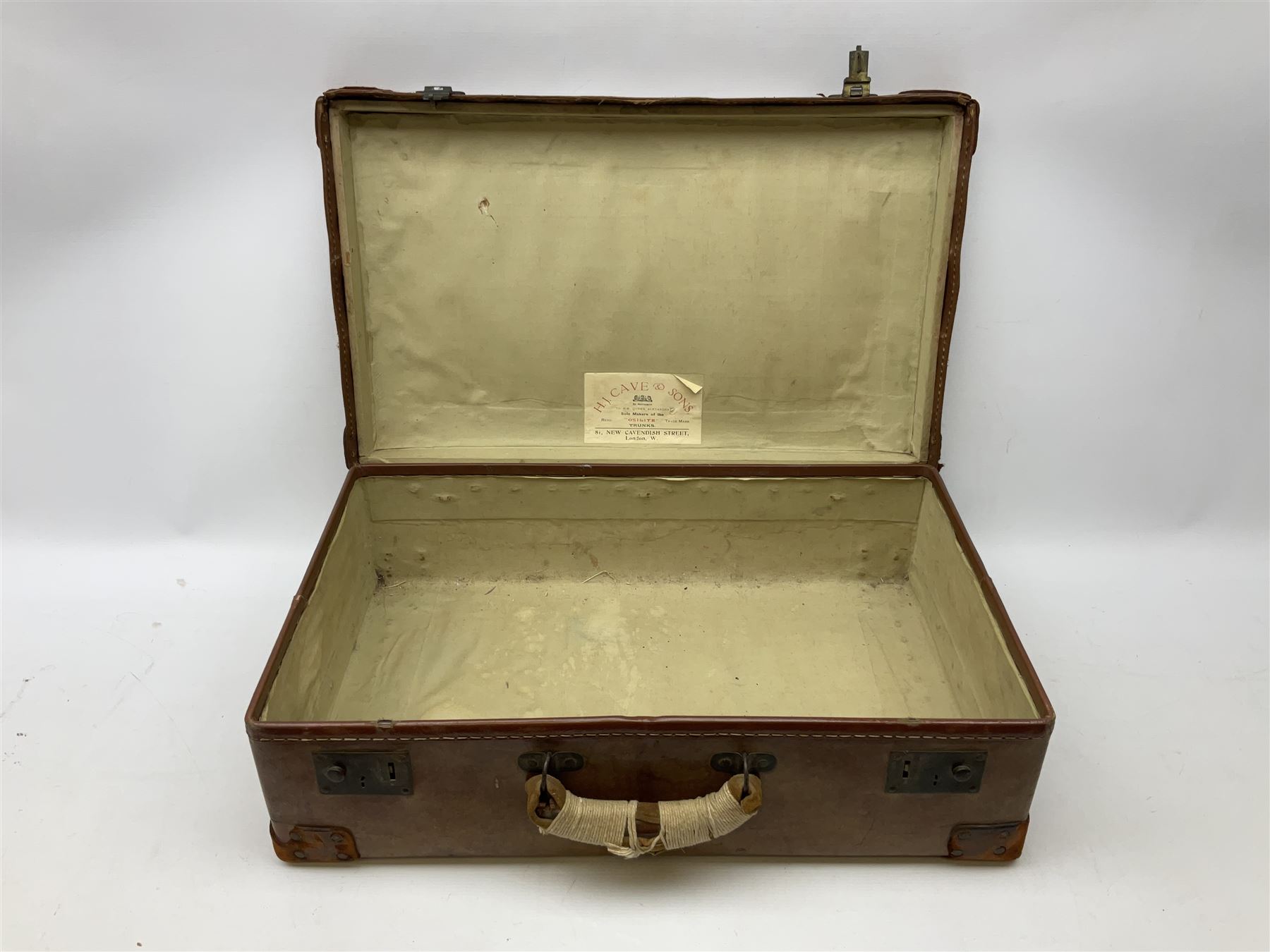 A leather bound 'Osilite' trunk by H.J. Cave & Sons, inscribed for