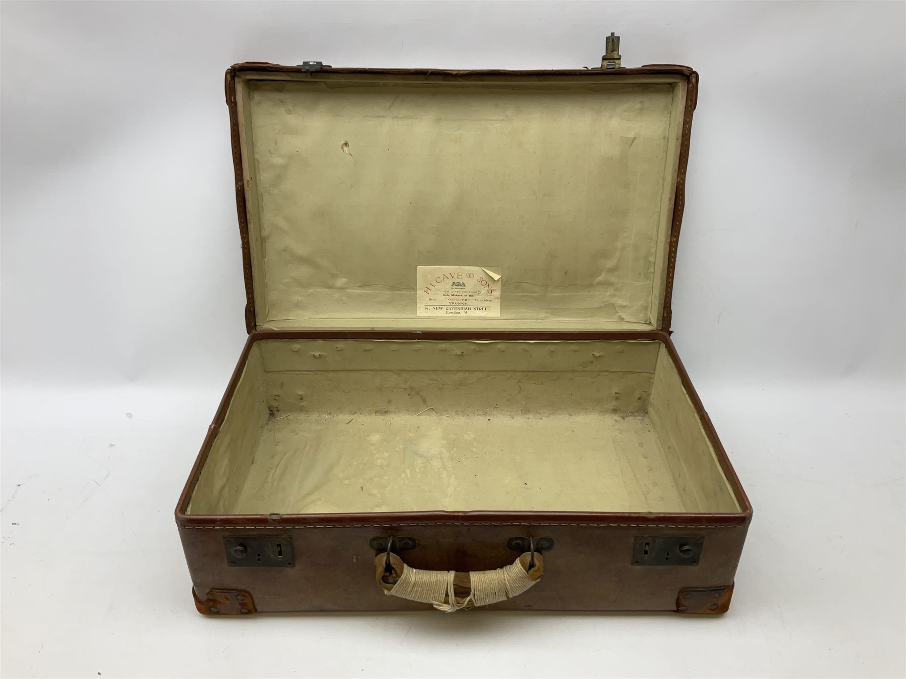 Vintage leather suitcase, by H. J. Cave and Sons of London, with two button slide locks to front, leather handles, reinforced leather corners, manufacturer's label to interiors, L64cm
