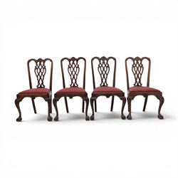 Chippendale design set of ten (8+2) mahogany dining chairs, serpentine cresting rails with carved detail over pierced ribbon-tied splats, red damask upholstered drop-in seats, on cabriole supports with acanthus carved knees and claw and ball feet