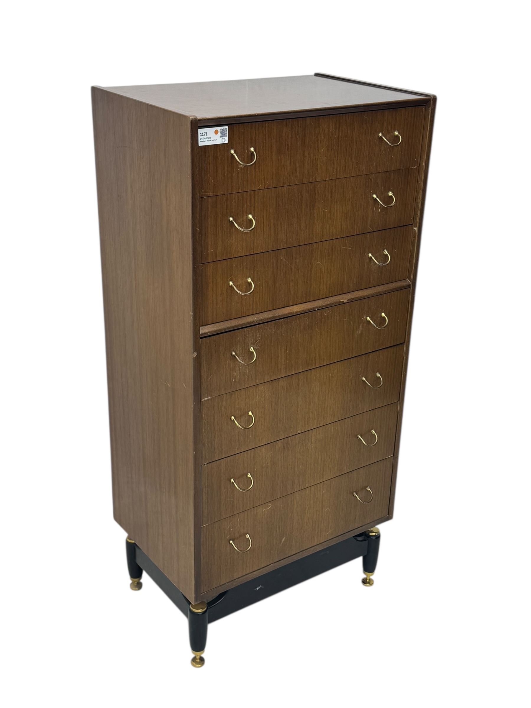 G-Plan teak tallboy, seven drawer chest with brass loop handles, ebonise base with adjustable brass terminals