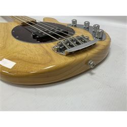 Ernie Ball Music Man Sting Ray 4 string bass guitar, in natural finish with roasted maple neck and tortoiseshell effect scratch guard, serial no 87485, in black Music Man hard case, guitar L114cm