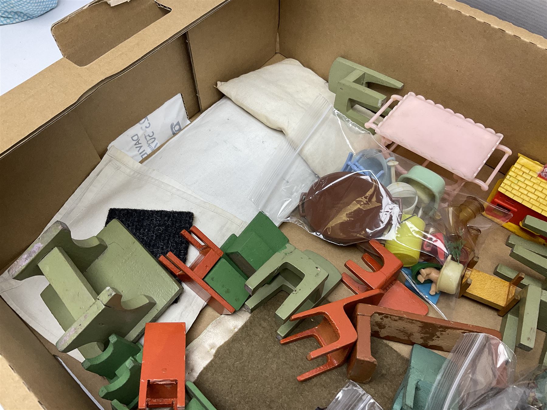 Quantity of various scale 1930s doll's house furniture including wooden grand piano, tables and chairs etc; plastic accessories including Fairy Lite sewing machine, trays, table wares, buckets, high chair etc; metal items including tin-plate doll's pram, terrestrial globe, die-cast typewriter and telephone, companion set and coal scuttle etc