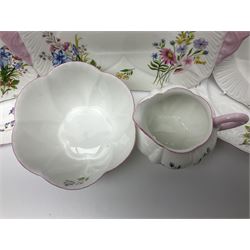 Shelley Wild Flowers pattern part tea service, comprising four cups and saucers, four dessert plates, cake plate, milk jug and open sucrier