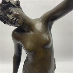 Bronzed semi nude female figure with one hand raised, upon a marble plinth, H43cm  