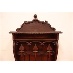  19th century oak gun cabinet, raised carved top with knights helmet finial, planked back with scrolled sides carved 'I Carved The Rack As You May See To Hold The Guns For Doctor Lee AD 1864 J. E. Humphries Thame'  three pierced carved doors aand fall front carved with crest 'Fide et Constantia' trans. Strong in Strength and Work W51cm, H187cm, D25cm  