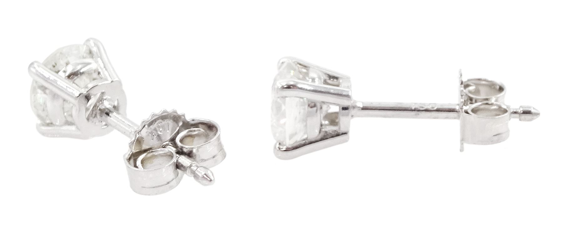 Pair of 18ct white gold round brilliant cut diamond stud earrings, total diamond weight 1.01 carat, with World Gemological Institute report