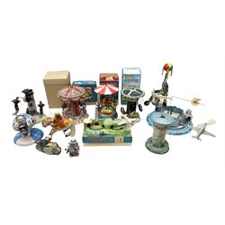 Mid 20th century and later tin plate clockwork toys, to include merry-go-rounds, spaceship carousel, walking robot, Schylling airport control tower, monkey riding horse, astronaut space station etc, including German and Japanese examples, some with boxes (12)