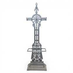 Late 19th century cast iron hall stand in the style of Christopher Dresser, cross shaped upper section with radiating wheel motif and applied hooks, architectural upright with pierced Gothic and geometric detail, fitted with rectangular drip tray and pierced surround, raised on stepped plinth base with bead decoration