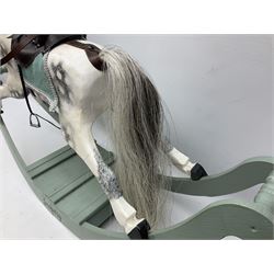 'Zachary' - small painted wooden rocking horse, the dappled pony with mane, tail, simulated leather saddle and stirrups L90cm H59cm