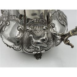 Victorian silver three piece tea service, comprising teapot, twin handled open sucrier, and milk jug, each of bellied form with acanthus capped scroll handles, the sides embossed with alternating scroll edged vacant panels and panels containing a pair of birds, upon four palmette feet, the teapot with ivory insulators to handle, and bird finial to the hinged domed cover, hallmarked William Hunter & Son, London 1861, teapot H19cm, including handles sucrier H13.5cm, including handle milk jug H12cm

This item has been registered for sale under Section 10 of the APHA Ivory Act