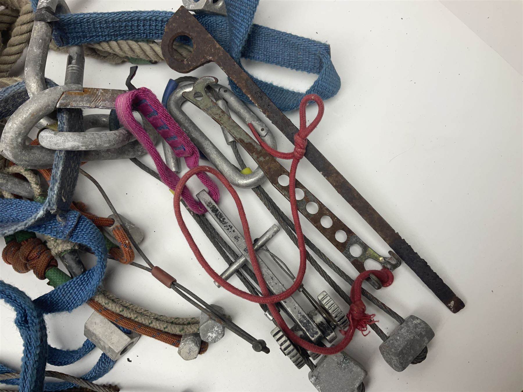 Collection of 1960s/70s climbing equipment including two original Hamish McInnes Pterodactyl ice axes, Joe Brown helmet, carabiners, ropes and wires etc