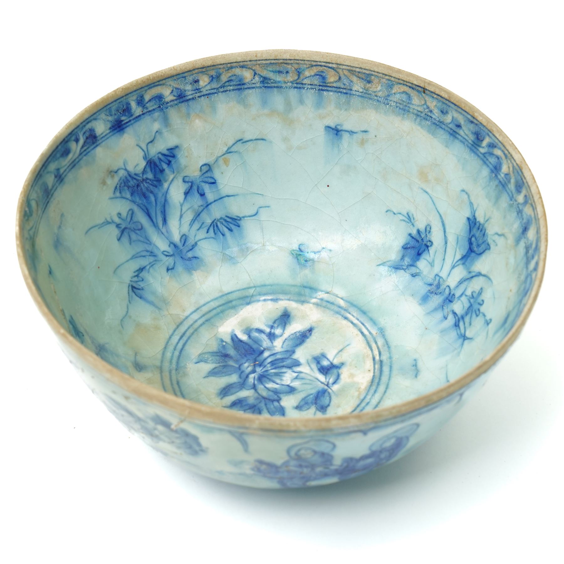 17th century Persian Safavid bowl decorated in the Chinese manner in blue and white with figures and flowers and with pseudo Chinese marks D23cm