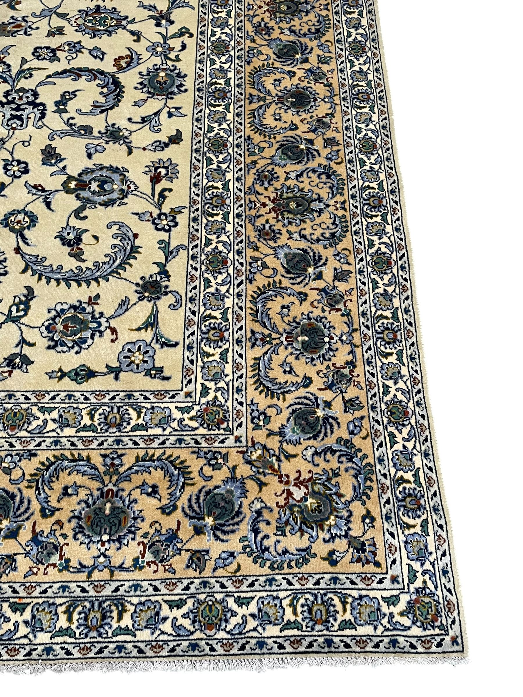 Persian Nain pale sage ground carpet, decorated with curled leaf motifs and palmettes, the busy borders decorated densely with similar design, within floral pattern guard stripes 