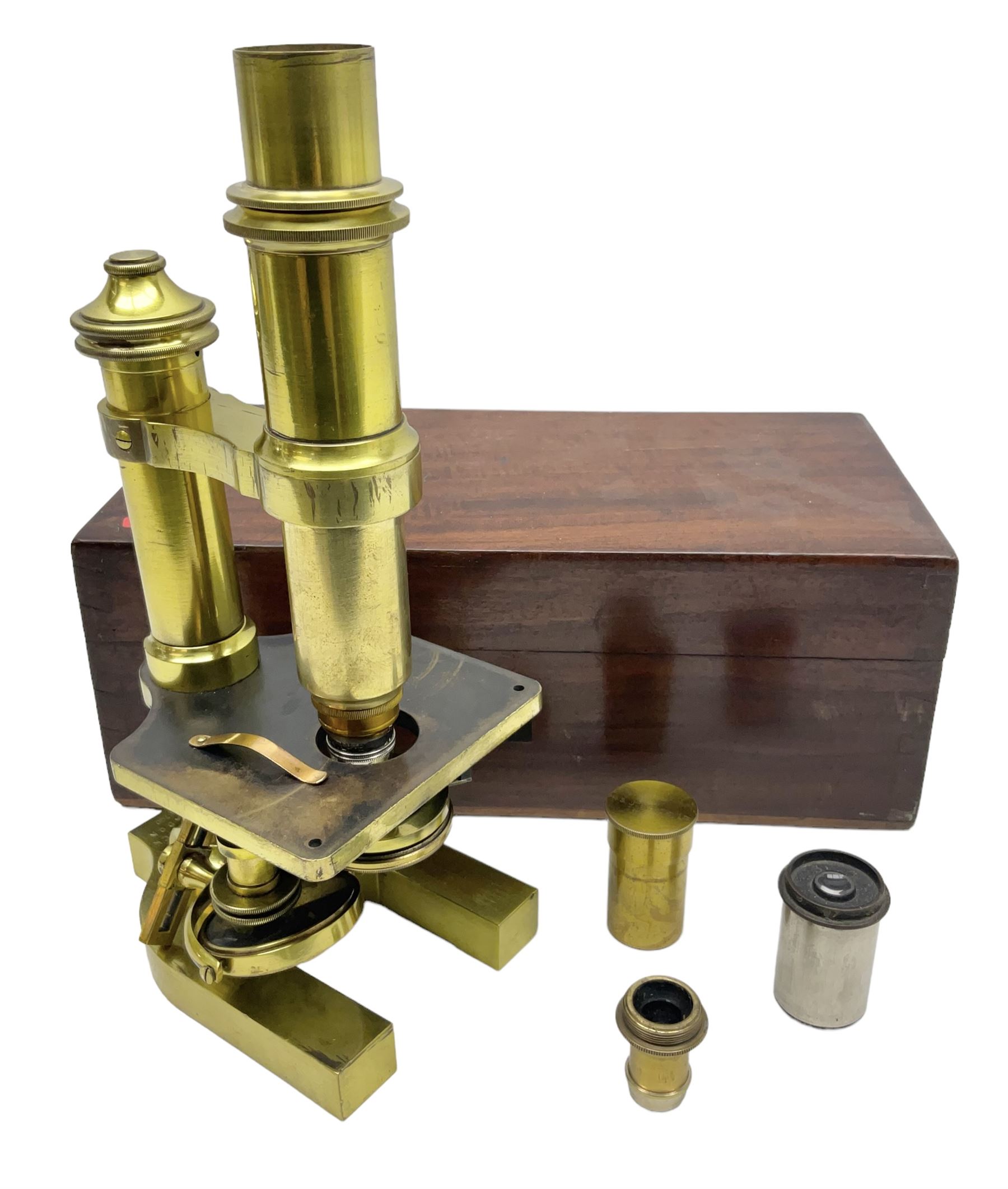 19th century brass monocular microscope by R. & J. Beck London No.18760 with hinged column and pitchfork base H25cm; in fitted mahogany case with two lenses
