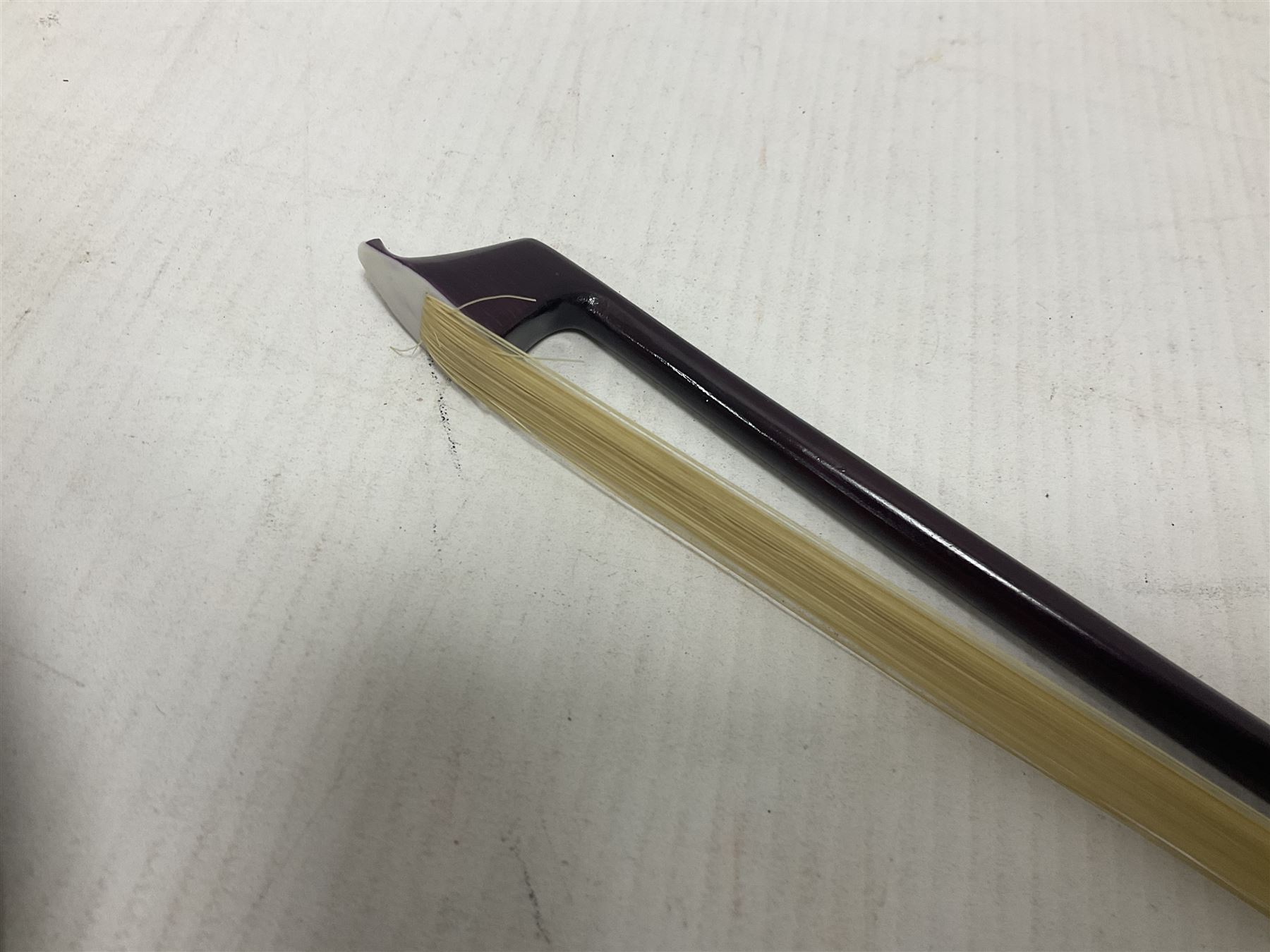 Intermusic 3/4 violin with a violet coloured solid wood body, ebonised fingerboard and fittings, bow and hard case, length 54cm