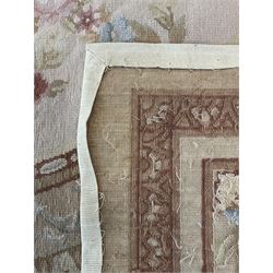 Late 20th century French style needle work Aubusson rug, circular field decorated with floral garlands and flower head motifs, multi-band border