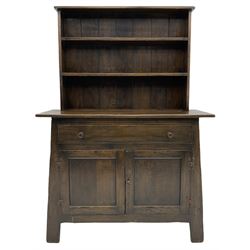 Early 20th century dark oak dresser, raised back with two plate racks, single drawer above two cupboards