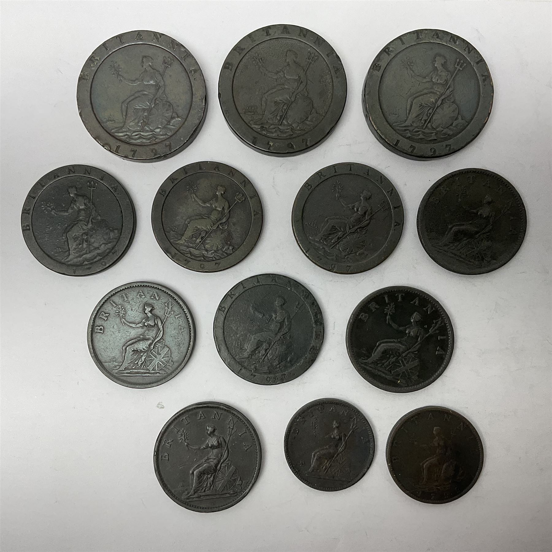 Two George III halfpenny coins dated 1799 and 1806, four pennies dated three 1806 and 1807, four 1797 cartwheel pennies and three 1797 cartwheel two pence coins