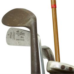 6 Hickory shafted golf clubs including Niblick by Forgan & Son, St Andrews, three putters and two woods in a canvas bag 