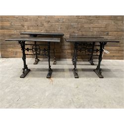 Four cast iron pub or bar tables with rectangular tops