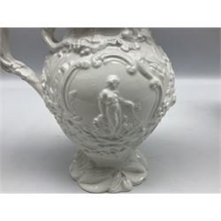Pair of early/mid 19th century Copeland and Garrett white glazed pitchers, modelled in the Georgian style and moulded with the figures of Venus the Roman Goddess of Love, and Aurora the Roman Goddess of Dawn, within C scroll borders and foliate surround, the naturalistically modelled handle leading to a fruiting vine beneath the rim, upon a spreading base moulded with seashells, with printed green crowned wreath mark beneath, H20cm