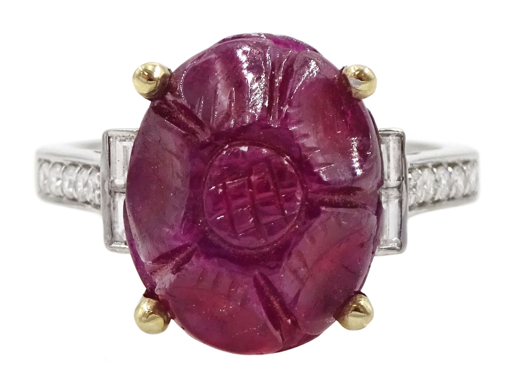 18ct white gold carved ruby ring, set with two baguette cut diamonds either side and diamond set shoulders, ruby approx 6.00 carat