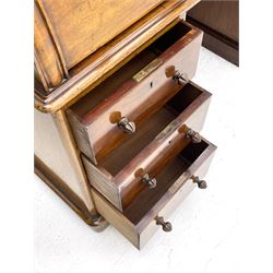 Victorian mahogany cylinder roll top secretaire desk, raised document compartments enclosed by three sliding glazed doors, the roll top revealing sliding sloped writing surface with hinged lid, pigeon and letter holes, the twin pedestals fitted with three drawers, plinth base