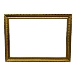 Modern gilt frame, edged with leaf decoration with reeded inner, aperture 65cm x 96cm