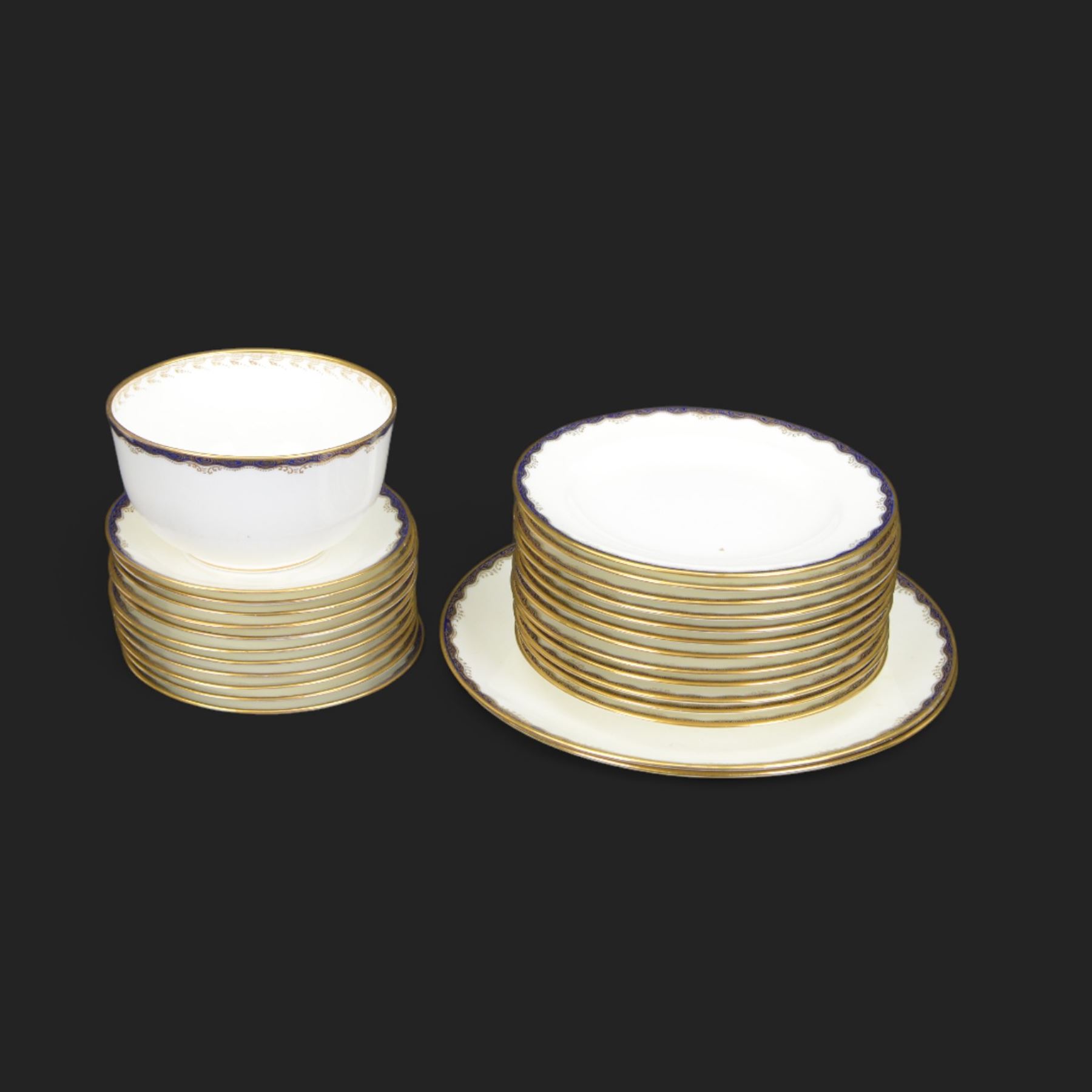 Wedgwood tea service, comprising teapot and stand, hot water jug, milk jug, open sucrier, twelve side plates, two sandwich plates, twelve cups and eleven saucers 