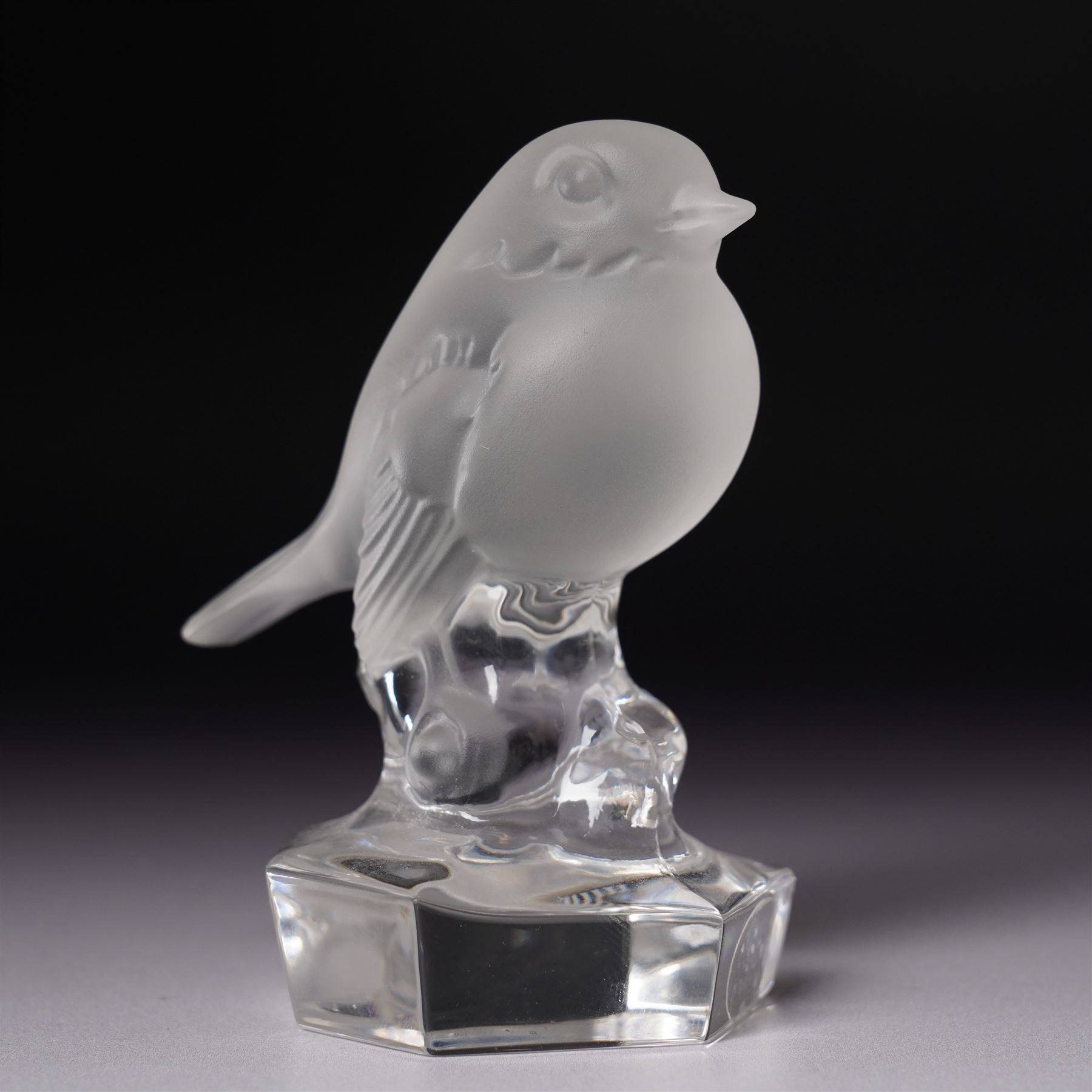 Baccarat figurine of a golfer, depicting a golfer in mid-swing, together with Nachtmann bird, golfer H24cm