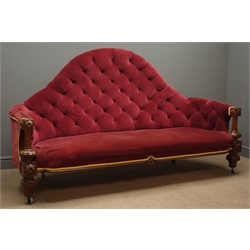  Victorian walnut framed high back sofa, upholstered in red velvet fabric with deep buttons and golden trim, carved and reeded apron and supports, L200cm  