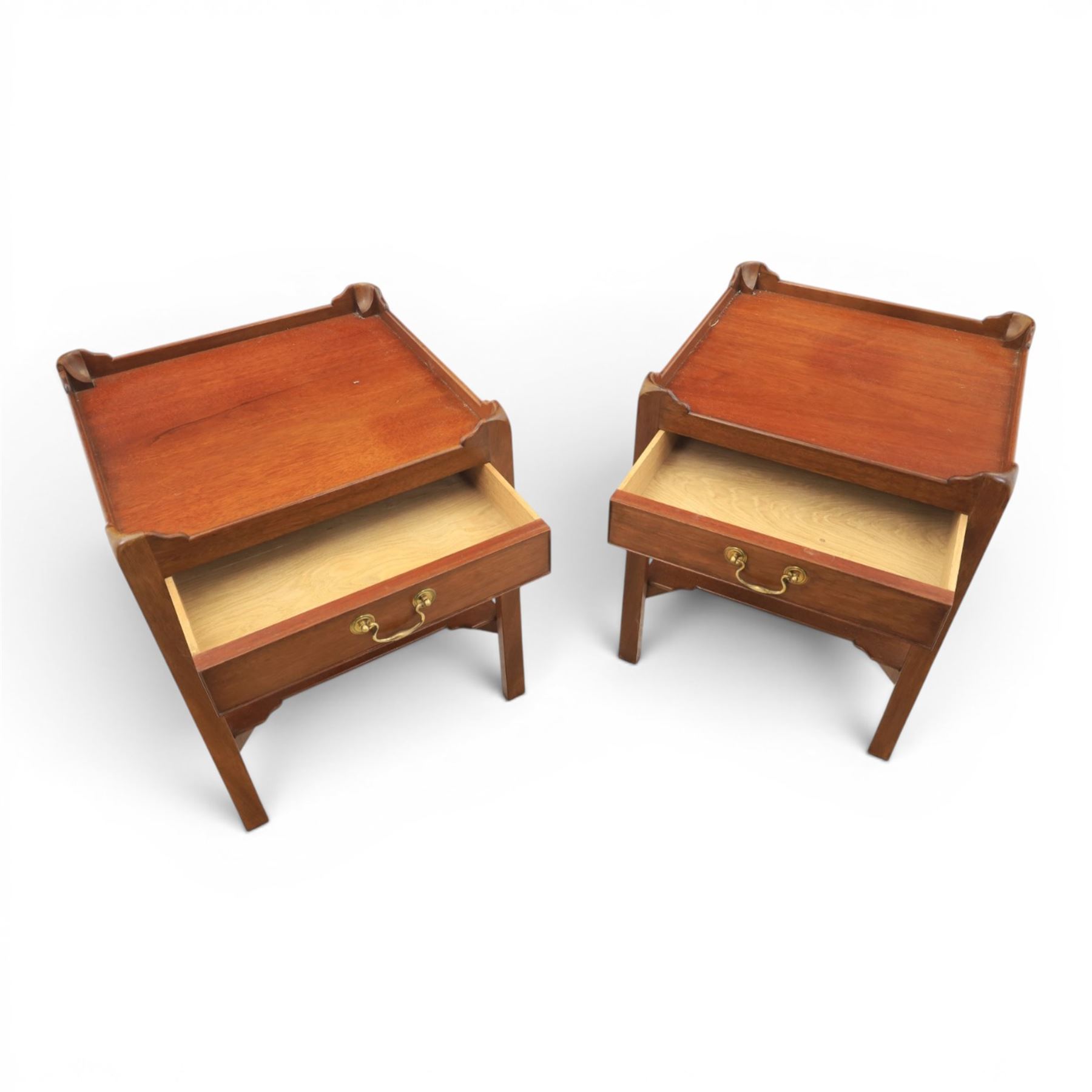 Georgian style pair of mahogany lamp tables, each with three-quarter gallery top above a single frieze drawer with brass swan neck handle, on square tapering supports united by an undertier