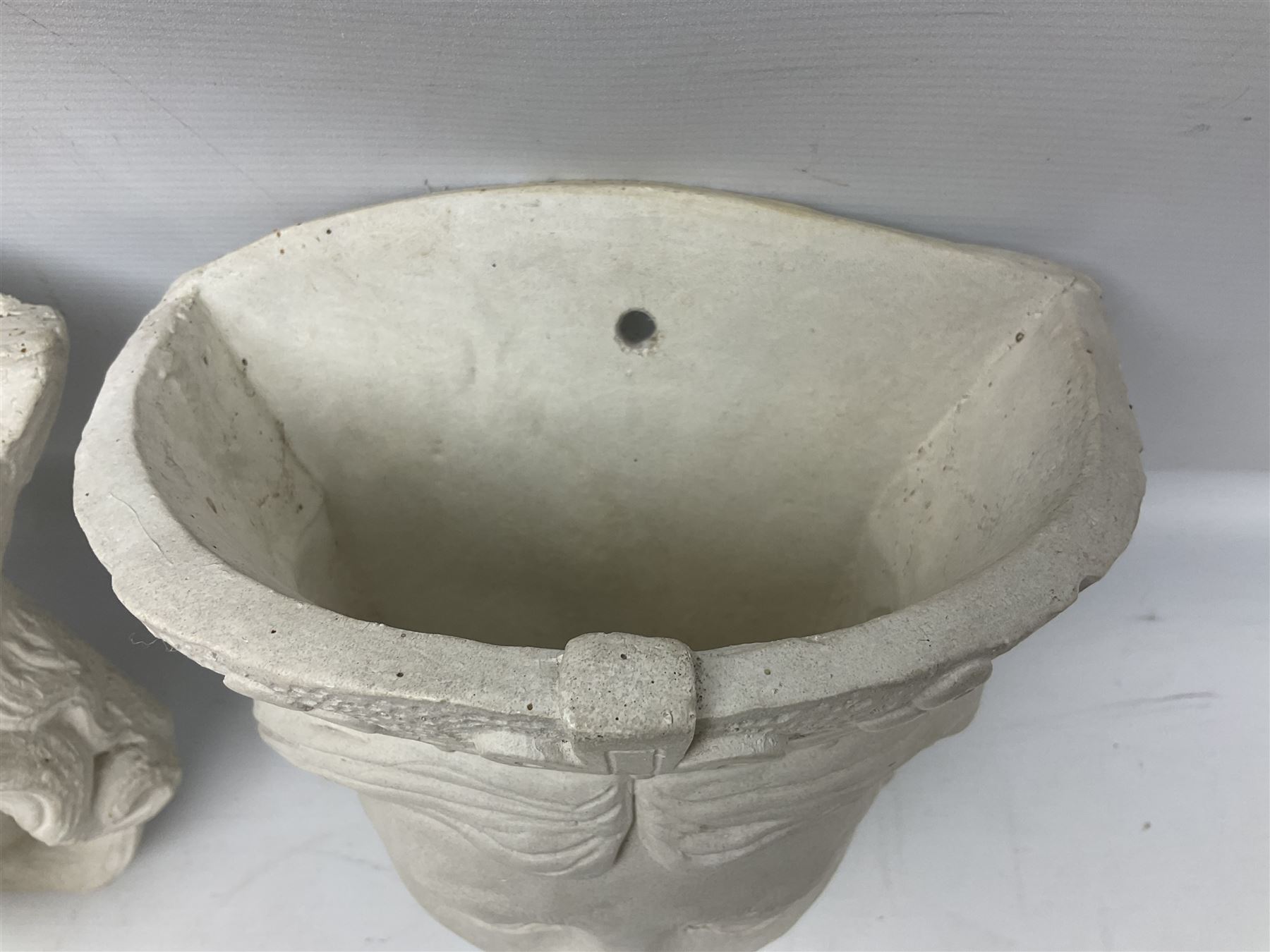 Pair of concrete wall planters in the form of a medieval King and Queen, painted white, L28cm
