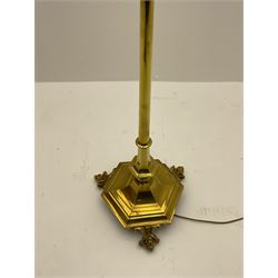 20th century brass finished floor lamp, telescopic stem on a shaped hexagonal platform base, raised on ball and claw feet (lowest height 136cm, measurement does not include shade fitting)