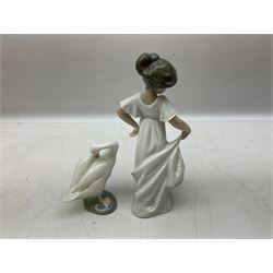 Quantity of figures to include Lladro example modelled as swan together with three Nao figures to include two April Showers no 1126, two with boxes 