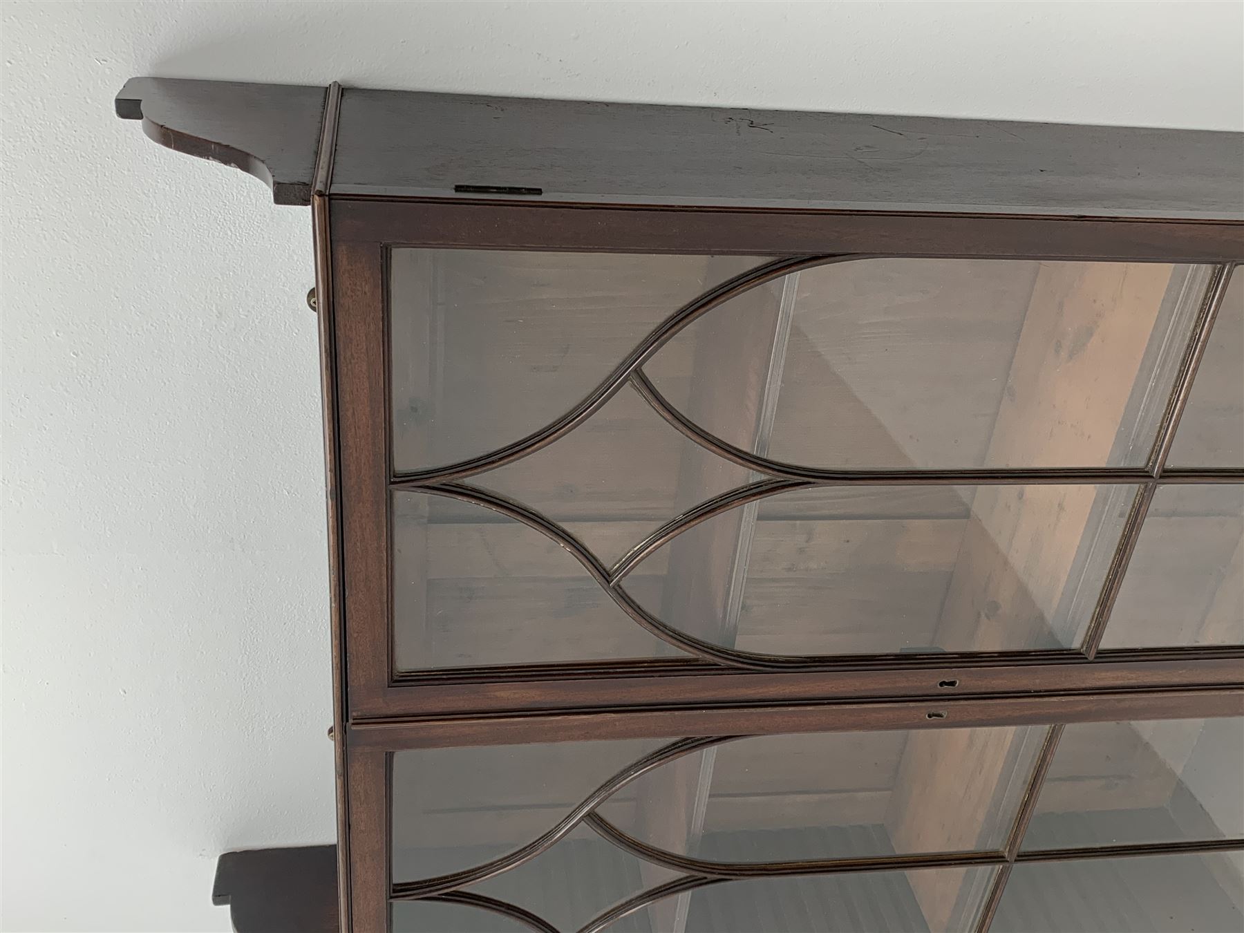 Georgian mahogany Gothic wall hanging cabinet, enclosed by two ogee pointed arch astragal glazed doors, plain sides with shaped top and bottom brackets