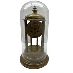 A French gilt brass Rotunda mantle clock with an eight-day enclosed countwheel striking movement striking the hours and half hours on a bell, with six reeded pillars on a circular stepped brass base with a domed canopy and finial, dial with painted Arabic numerals, decorative embossed centre and steel spade hands, under a glass dome. No pendulum or key. 

